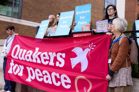 A group of Quakers holding signs saying Quakers for Peace A group of Quakers holding signs saying Quakers for Peace