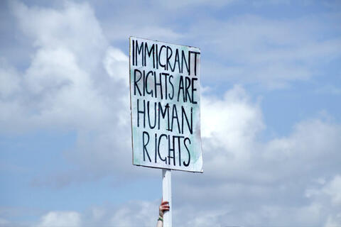 Banner saying "Immigrant rights are human rights"